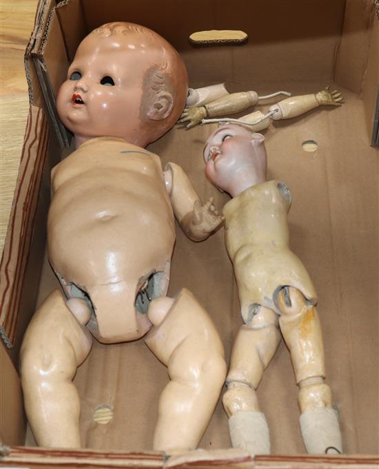 A Max Handwerk bisque-head doll and another doll